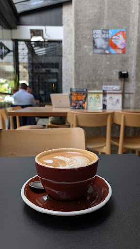 Flat white with latte art at Kopi Cafe.